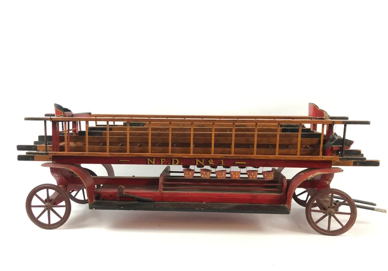Antique folk art model of a NYC fire department ladder truck