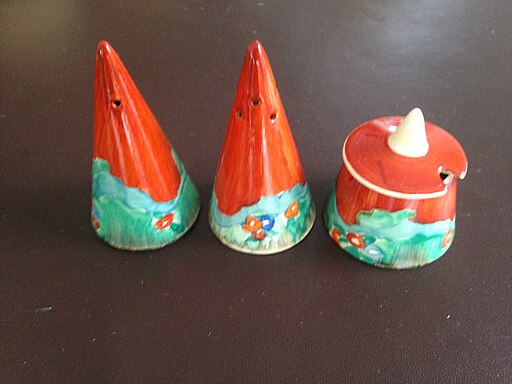 Clarice Cliff pottery sugar casters in the Forest Glen pattern.