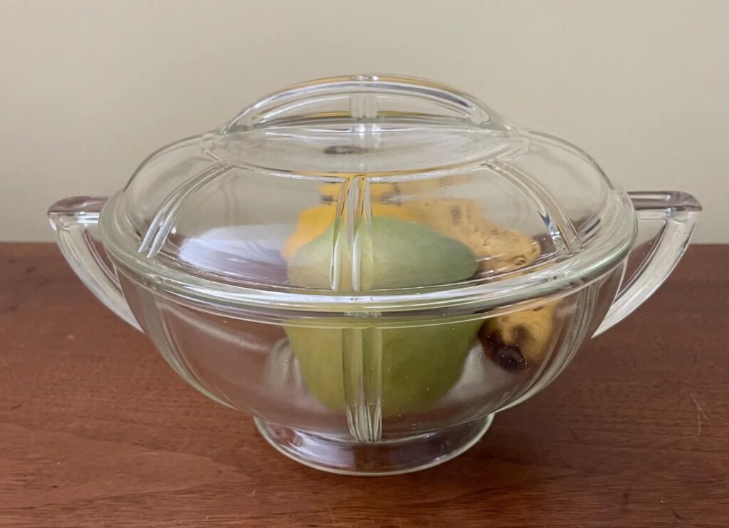 Glasbake queen anne casserole with fruit inside.